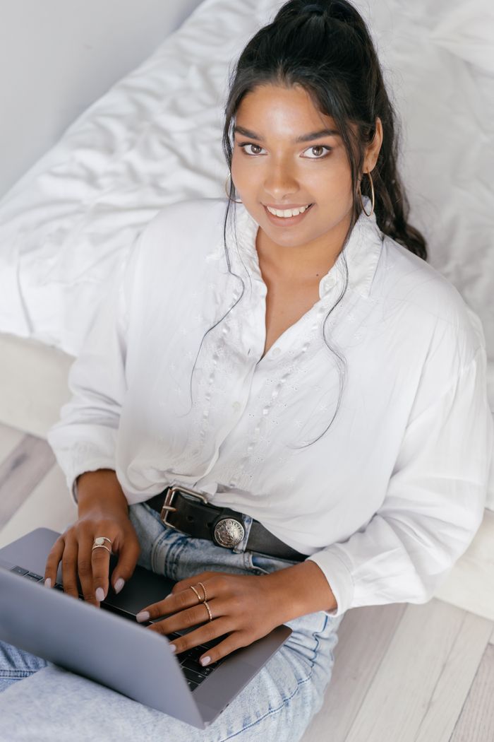 Indian woman using a laptop from home