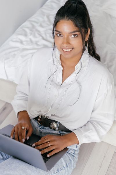 Indian woman using a laptop to access care